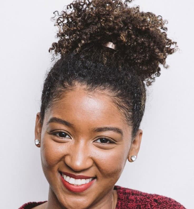 Smiling woman with curly hair