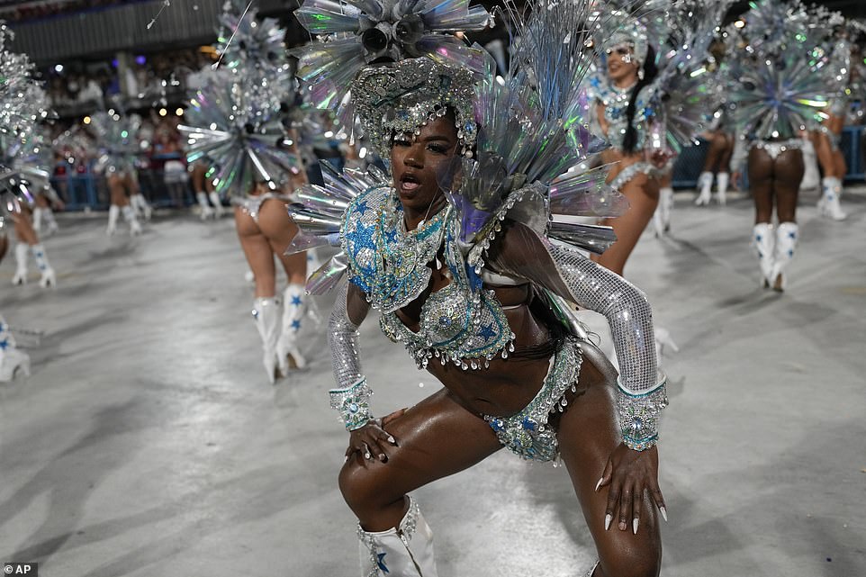 Performers from the Salgueiro samba school parade perform during Carnival celebrations at the Sambadrome in Rio de Janeiro in the early hours of Monday morning