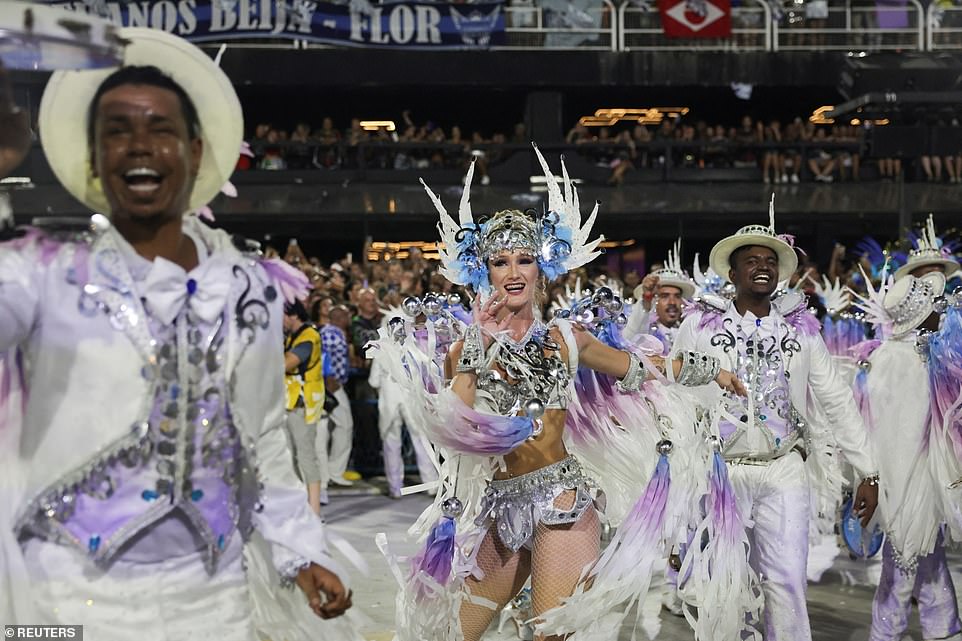Carnival revellers from Beija-Flor samba school perform in the carnival in the early hours of Monday morning