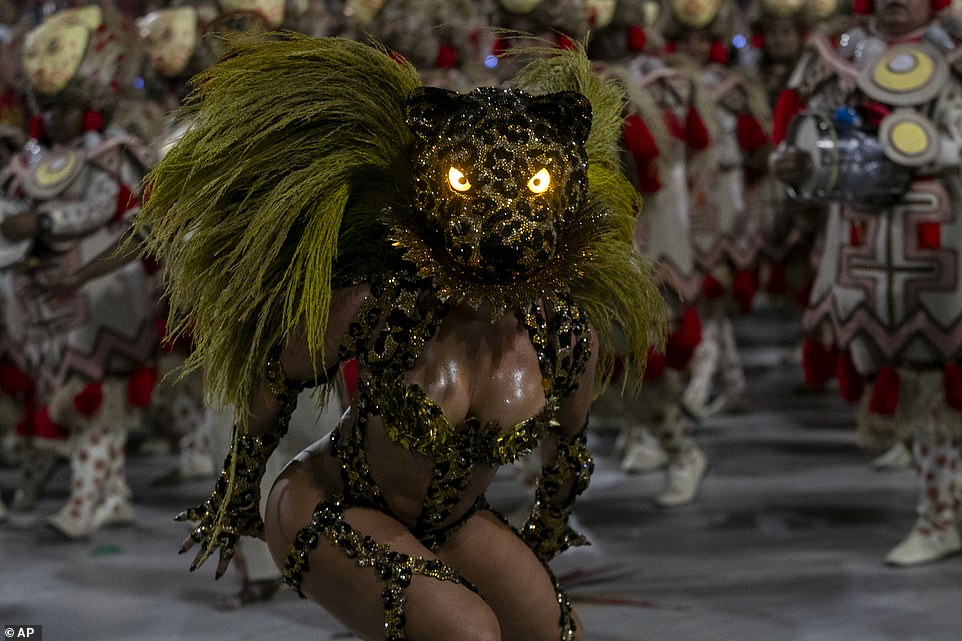 Drum queen Paola Oliveira from Grande Rio samba school parades during Carnival celebrations at the Sambadrome in Rio de Janeiro, Brazil, early on Monday