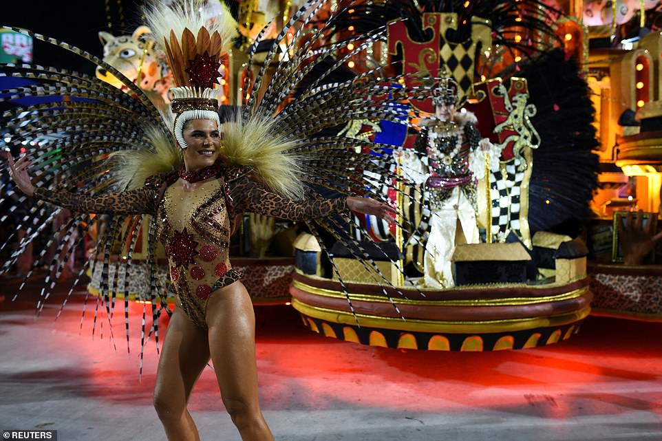 Revellers from Grande Rio Samba School perform during the night of the Carnival parade at the Sambadrome
