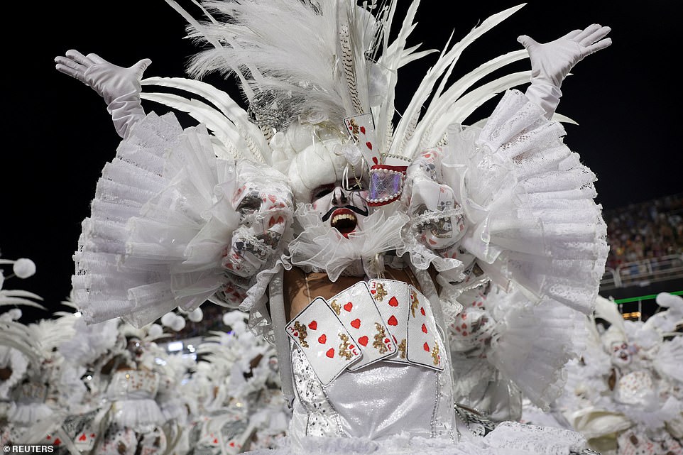 A reveller from Imperatriz Leopoldinense samba school performs during the night of the Carnival parade at the Sambadrome