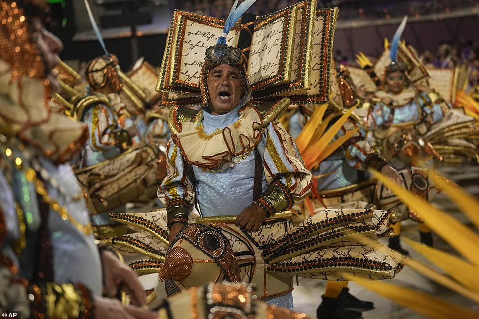 Performers from the Unidos da Tijuca samba school. Pulling together a show with more than 3,000 performers and a fleet of seemingly gravity-defying floats is no easy feat. The samba schools spend the entire year preparing - and often face a down-to-the-wire race to get ready