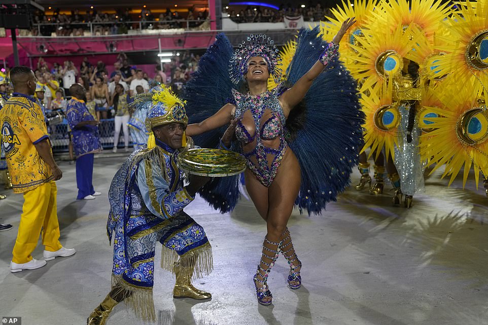 Performers from the Unidos da Tijuca samba school are seen in the carnival during the early hours of Monday morning