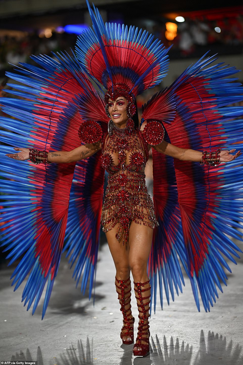A member of the Salgueiro samba school performs during the first night of the Carnival parade at the Marques de Sapucai Sambadrome