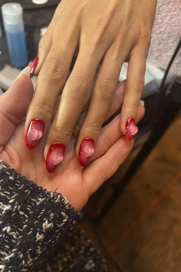 This photo provided by Julie Kandalec shows 3D Art Gel-Apres Gel Couleur. On Valentine's Day, why not express love on your fingernails? Julie Kandalec is a celebrity manicurist who notes some fun new trends. She says that traditionally, Valentine's nails were simple — solid red, a simple pink heart or a French manicure. Thanks to social media, there are now lots of ideas to try. (Julie Kandalec via AP)