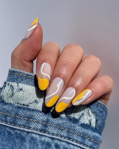 Yellow flag-inspired nail designs are on-trend for the 2024 Super Bowl.