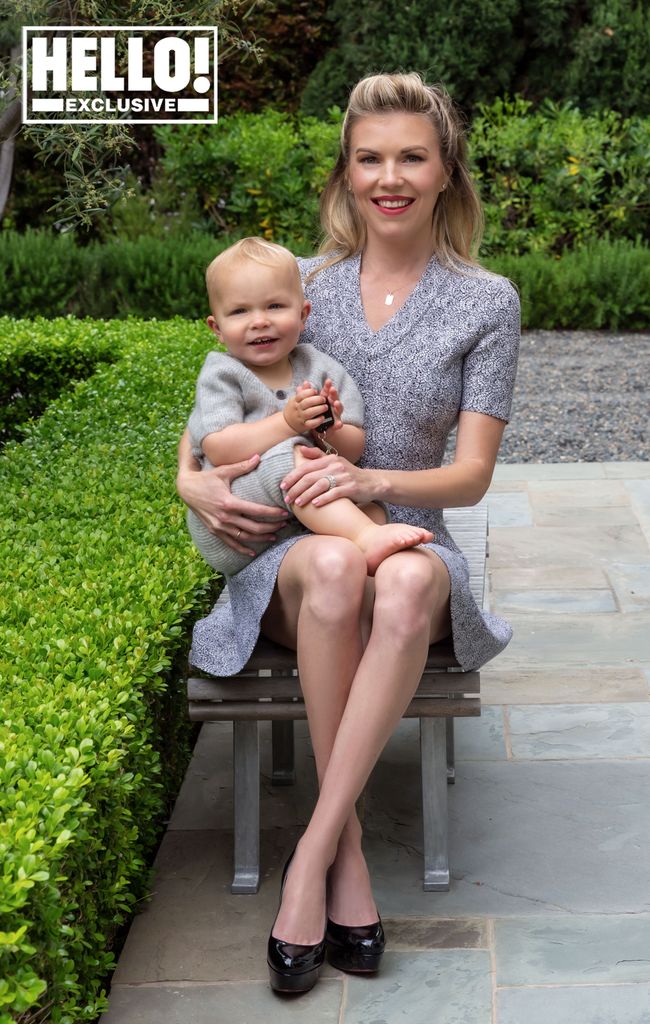 Tyler Ellis sitting outside in LA home garden with son Fitz Harold