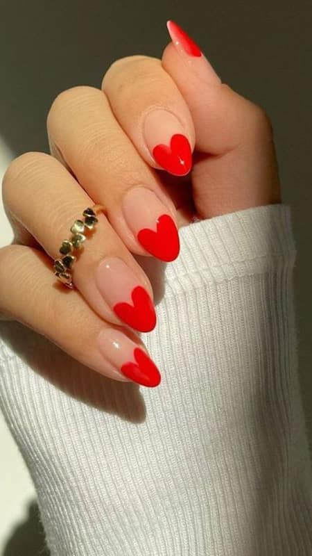 Heart French Tip: Subtle and refined, these nails feature a clean, soft pink base with a single heart on each, symbolizing an understated love.