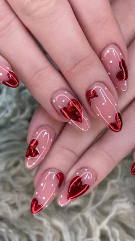 Glass Hearts Elegance: Glossy, see-through nails adorned with floating red hearts, offering a glass-like effect that's both chic and enchanting.