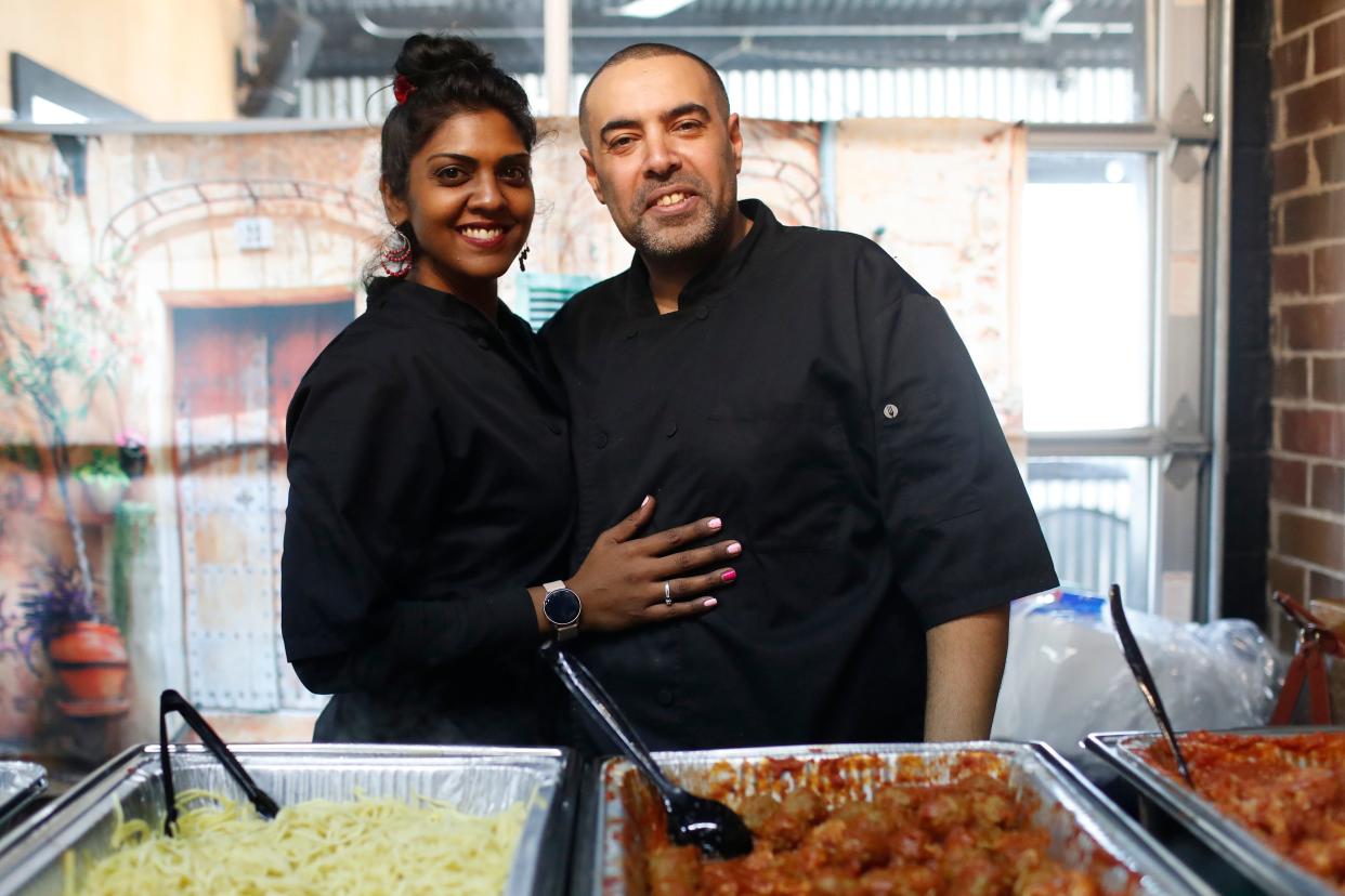 Kat and Felix Ahmed owners of BasKat Catering pose for a photo during the first Taste of the World Lunches at Athentic Brewing Co., in Athens, Ga., on Friday, Feb. 2, 2024. Taste of the World Lunches will be held every Friday at Athentic from 11 a.m. to 2 p.m.