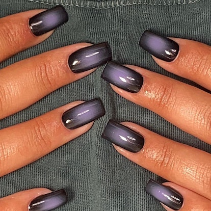 Lavender and black aura nails match the 