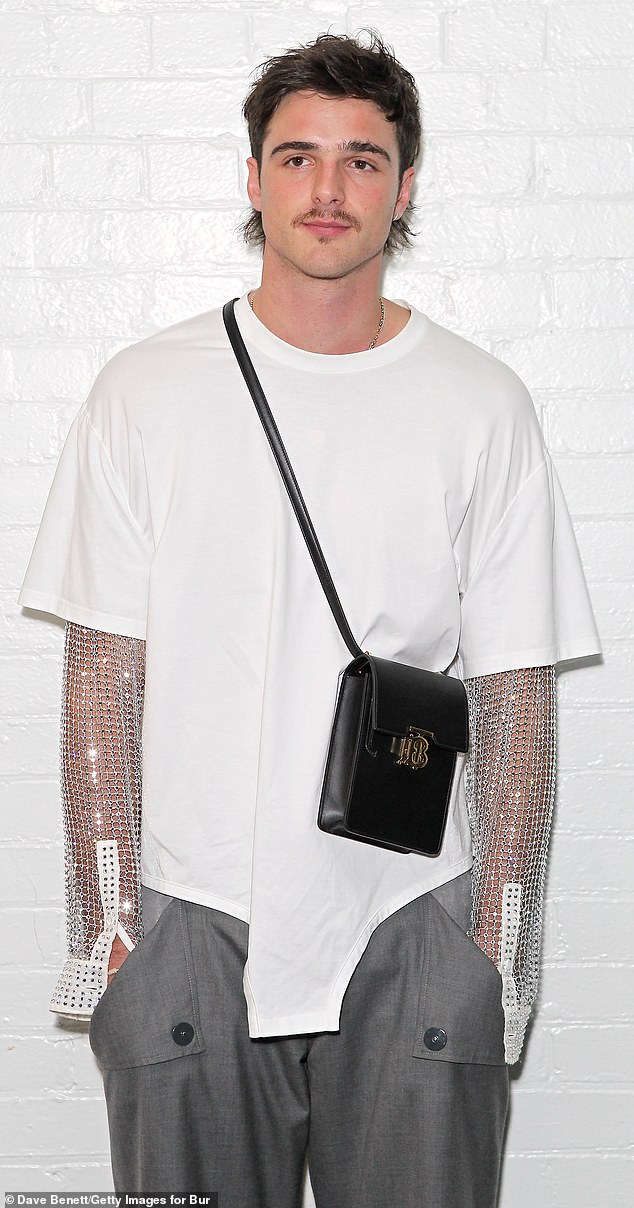 Fans are flocking to social media to praise Elordi's designer duds - as he's making the 'murse' into the latest must-have accessory