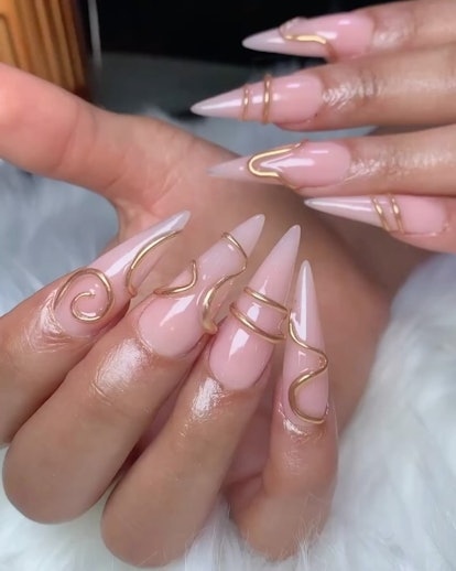 3D gold nail rings are on-trend for summer 2024.