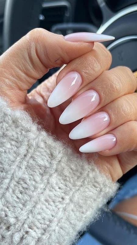 Classic Ombre: Long, sharp stiletto nails with a white and pink ombre design, embodying timeless grace with a modern twist.