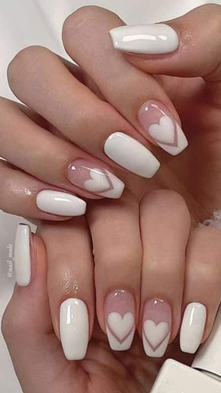 Heartfelt Simplicity: A clean, soft pink base with a single heart design on alternating nails, symbolising love in its minimalist form.