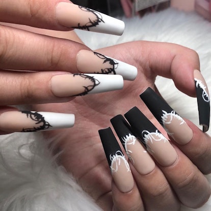 French tip nails with barbed wire designs match the 