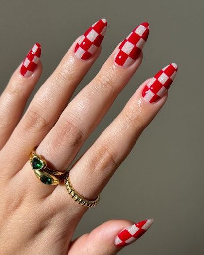 Red checkered nail art matches the 