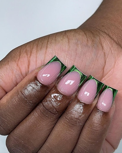 Green chrome French tip nails are trending for spring 2024.