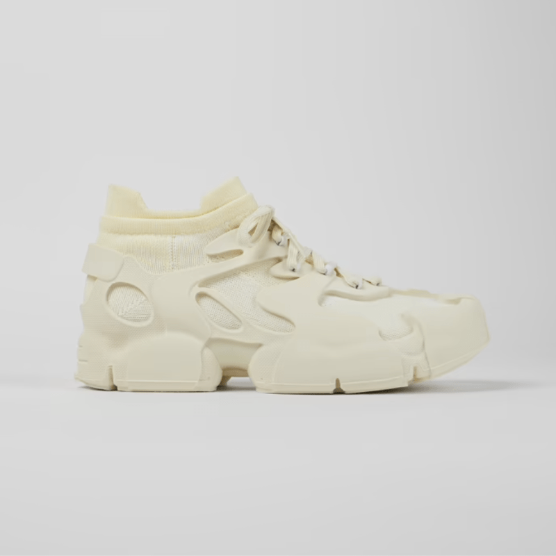 A chunky white sneaker with lots of sculptural detailing