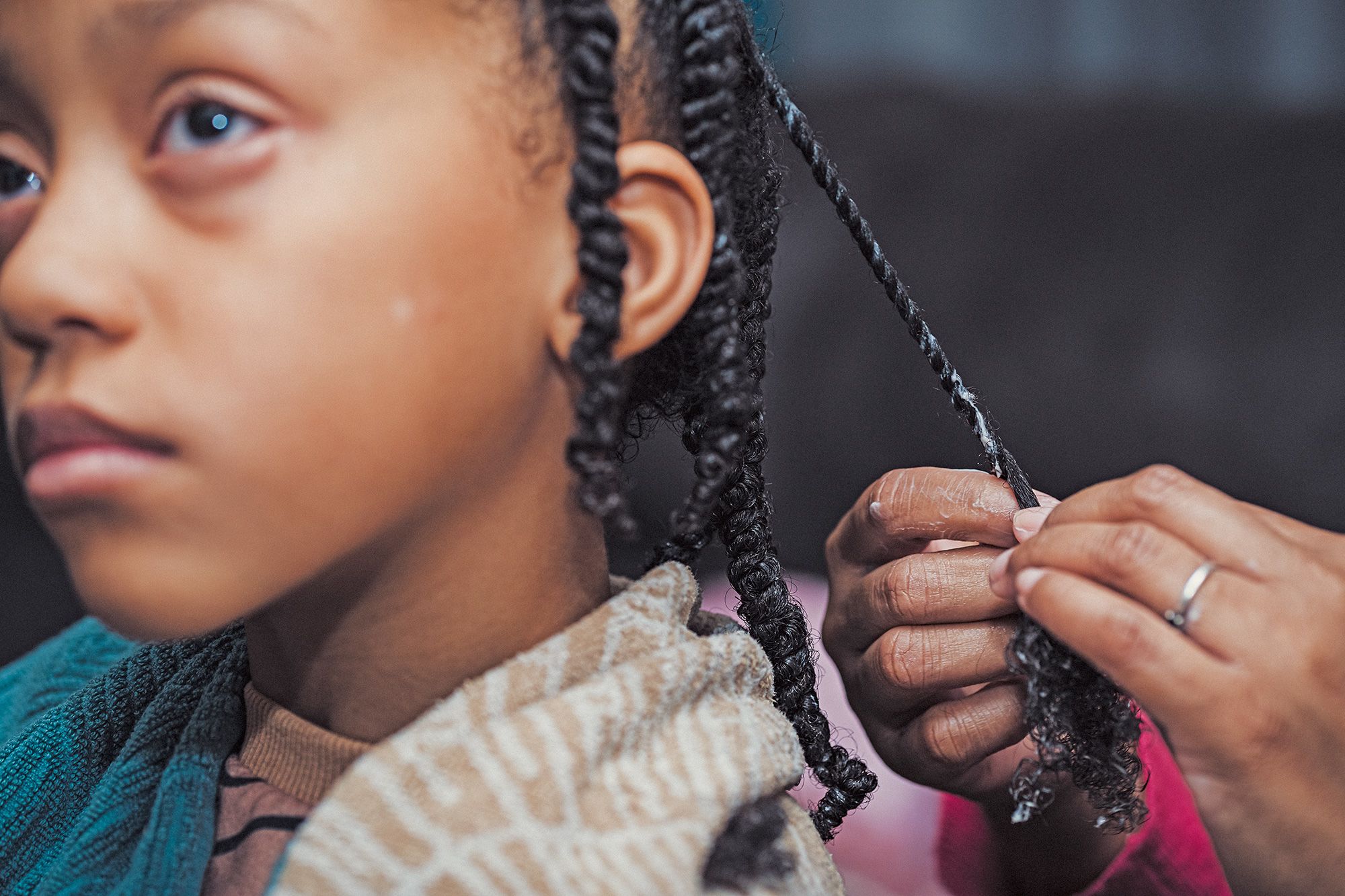 Wash day for Catelyn (pictured here) begins with her mother Tyrese applying a clay hair mask.