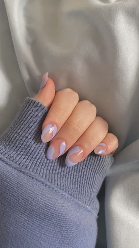 Lilac nails with an iridescent finish capture the essence of understated elegance, ideal for a subtle statement of style.