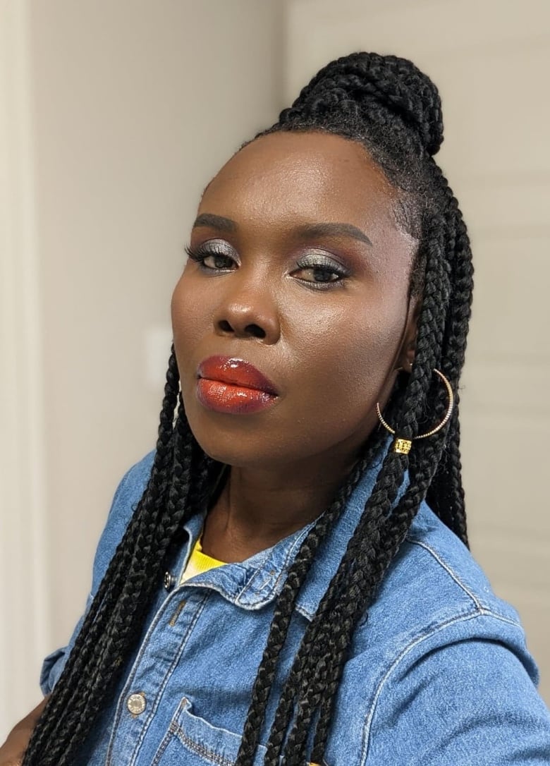 Black woman with hair done in braids.