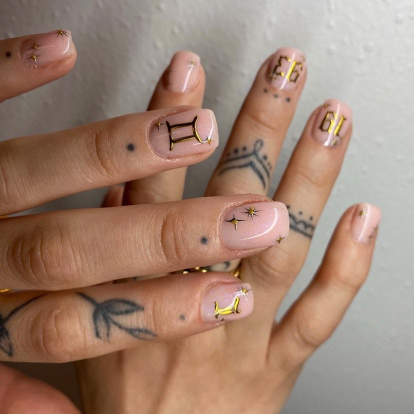 Gilded nail designs are perfect for Gemini season 2024.