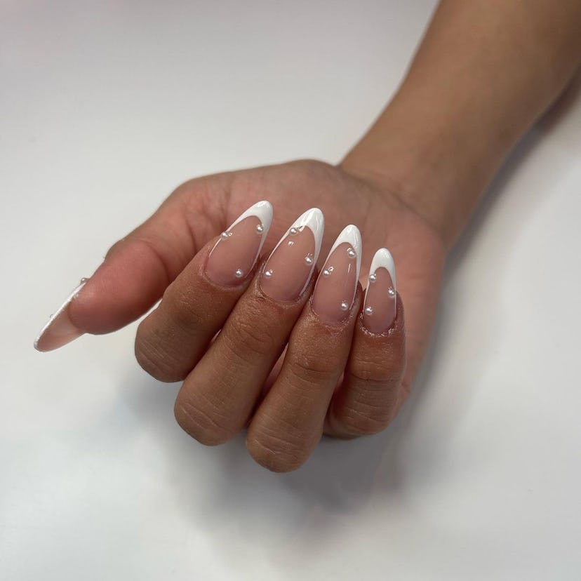 Try almond-shaped French tip nails with pearls.