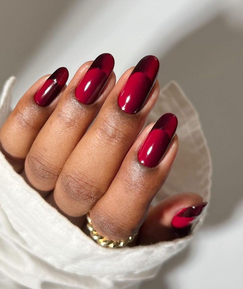 Try almond-shaped cherry red illusion French tip nails.