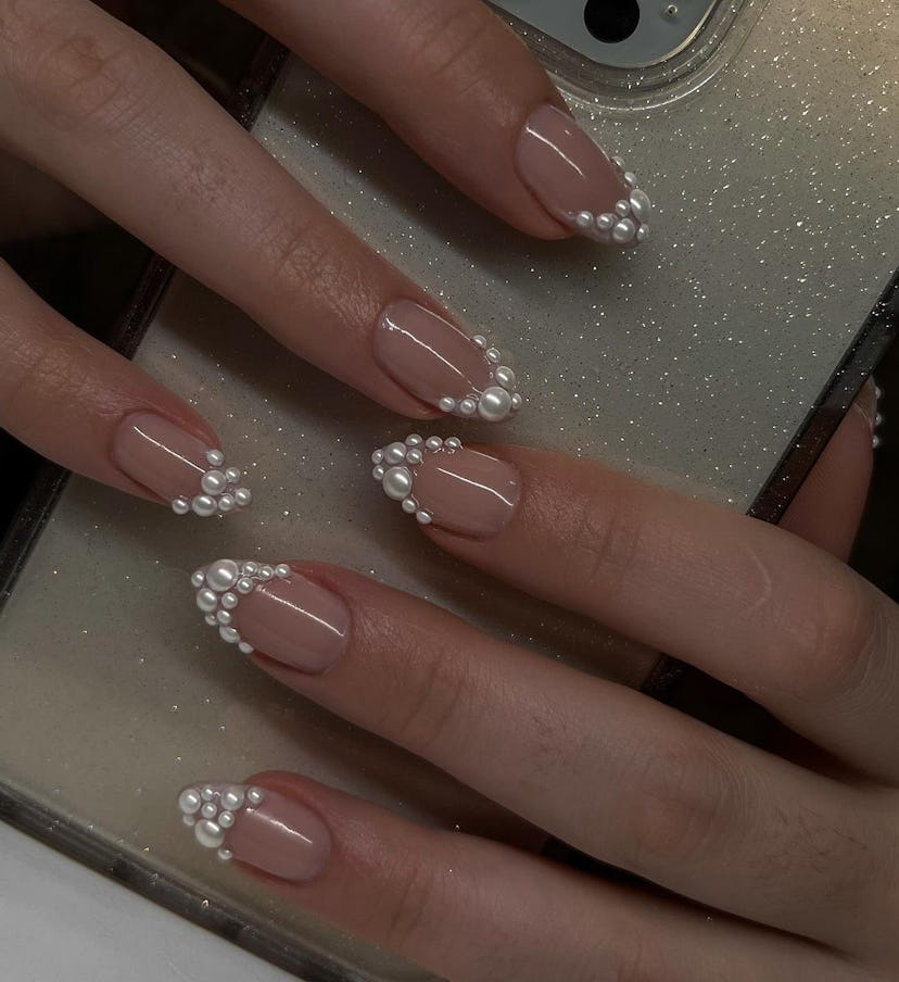 Pearl-encrusted French tip nails are perfect for Gemini season 2024.