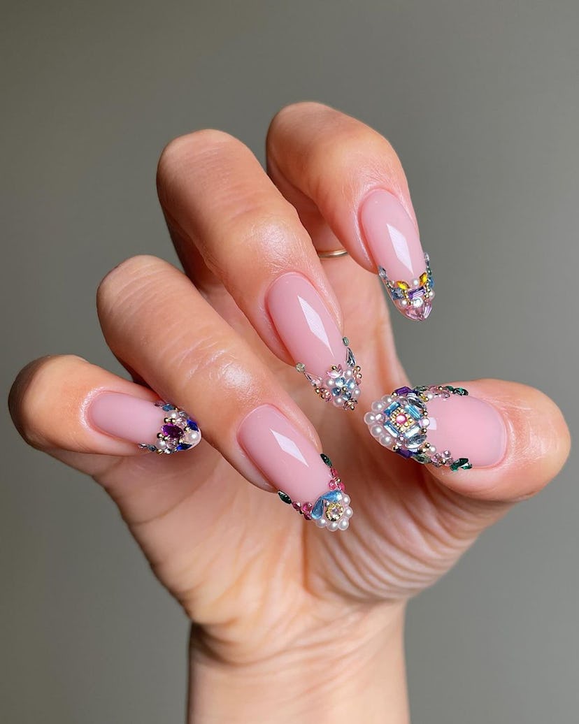 Try almond-shaped bedazzled French tip nails.