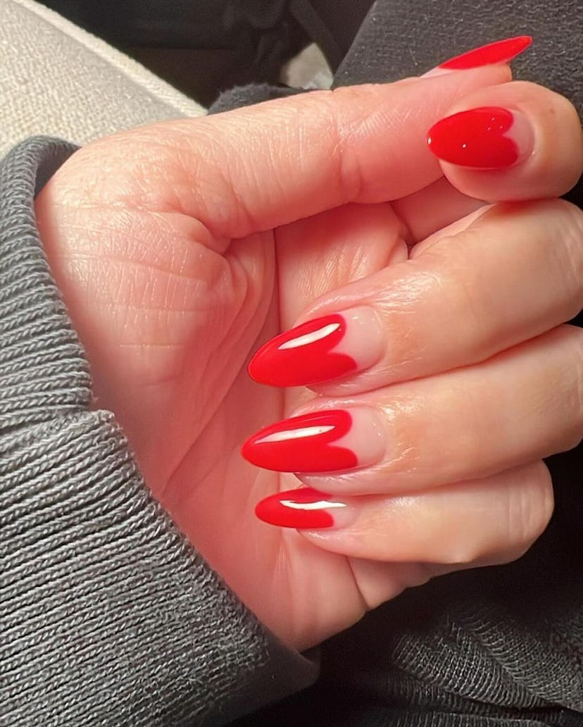 Try almond-shaped red French tip nails that look like hearts.