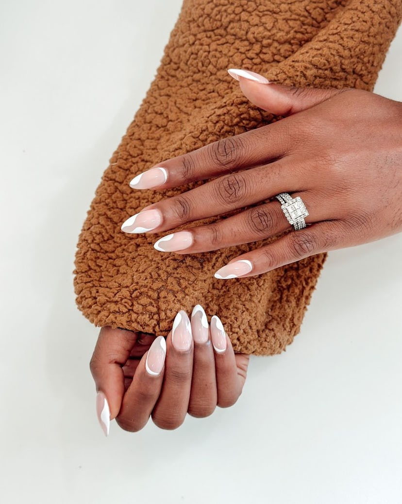 Try almond-shaped abstract French tip nails.