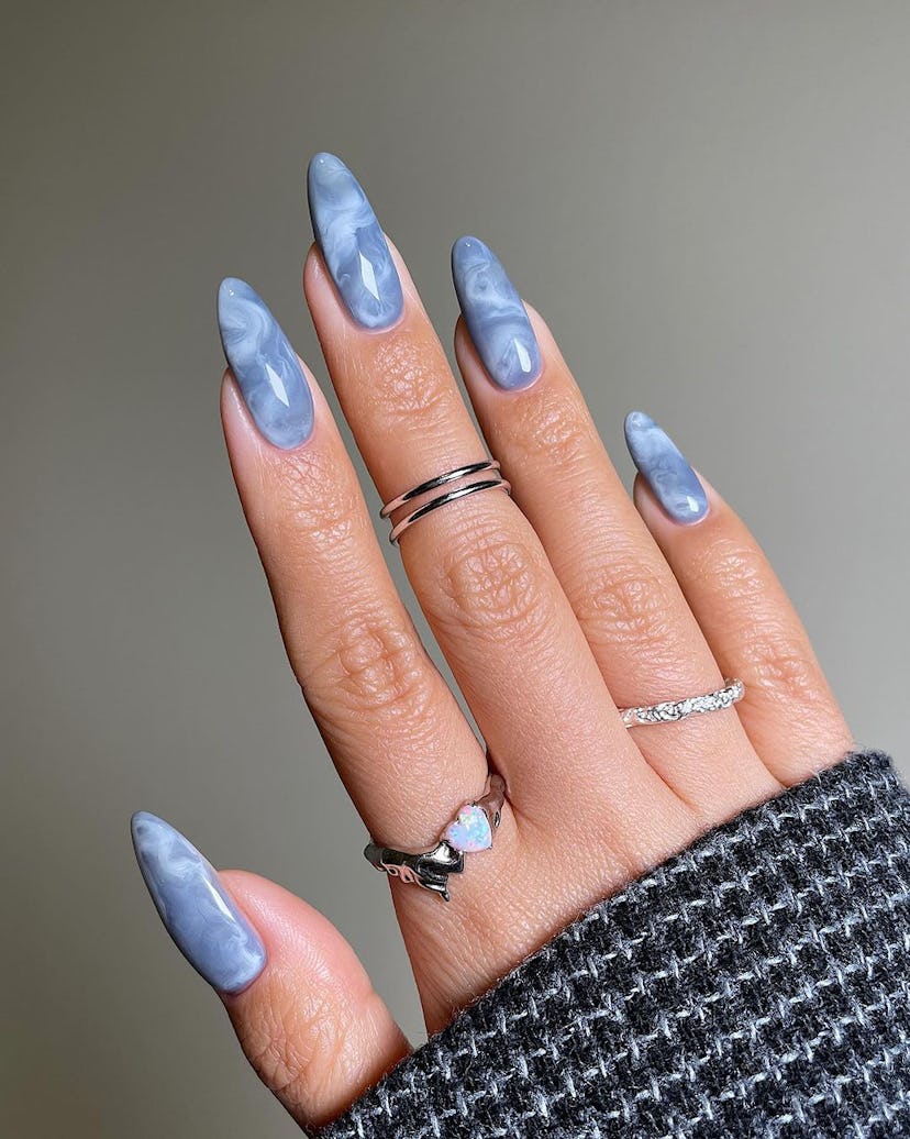 Sky blue cloud swirl nail art is perfect for Gemini season 2024.