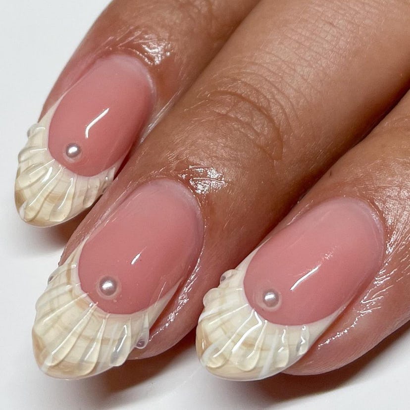 3D seashell French tip nails are on-trend for summer 2024.