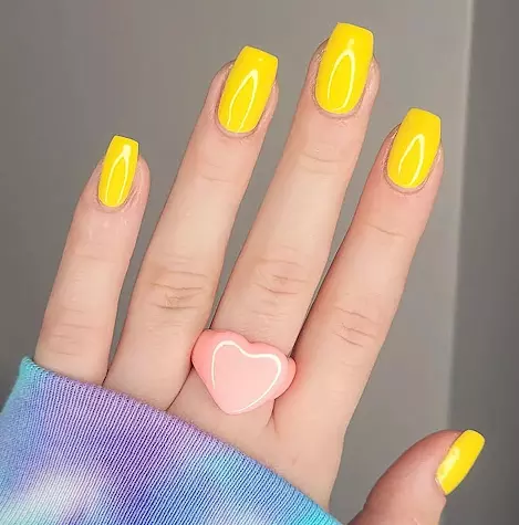 Sunny Delight Vibrant Yellow  Yellow is synonymous with sunshine and happiness, making it a perfect choice for a poppy-inspired look. A vibrant yellow nail paint can add a cheerful touch to your style, whether youre heading to the beach or a summer picnic.