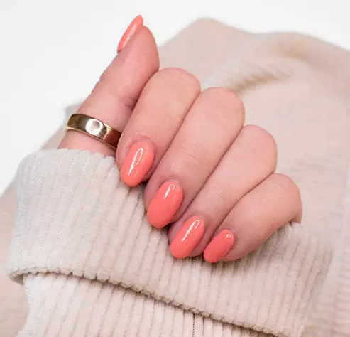 Coral Crush  For a softer take on the poppy trend, opt for a delicate coral nail polish that exudes elegance and charm. This versatile shade transitions seamlessly from day to night, making it a staple for any nail polish collection.