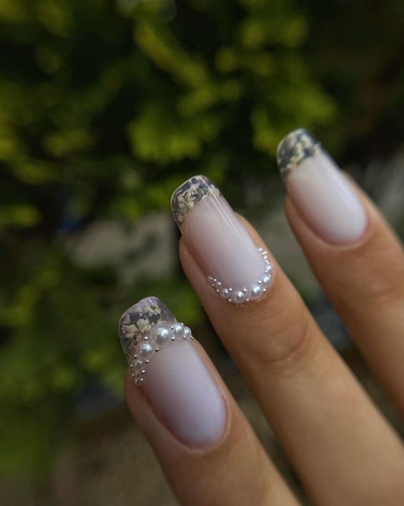 These pearl-lined clear French tip nails are inspired by 'Bridgerton.'