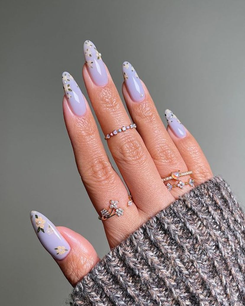 This pastel blue floral nail art is inspired by 'Bridgerton.'