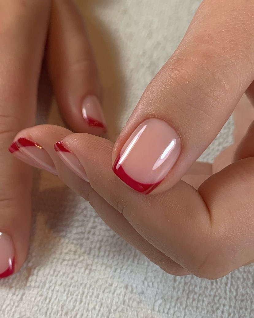 Red French tip nails are perfect for an Aries on their wedding day.