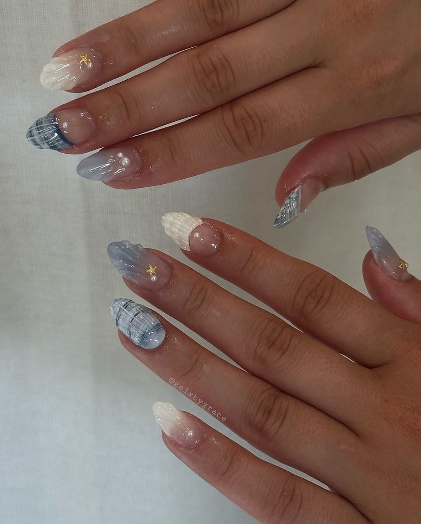 Blue and white seashell nail art is perfect for Cancer season 2024.