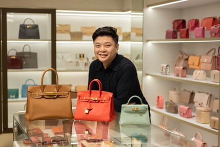 Owner Alex Leung with Birkin bags.