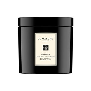 A 600g Jo Malone London Vitamin E Body Treatment Scrub in a black lidded jar