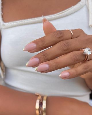 Gold chrome French tip nails