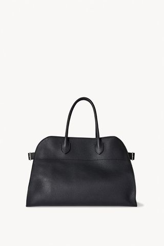 a black top-handle tote bag in black leather