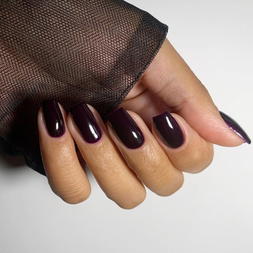 Black cherry nails are on-trend for fall 2024.