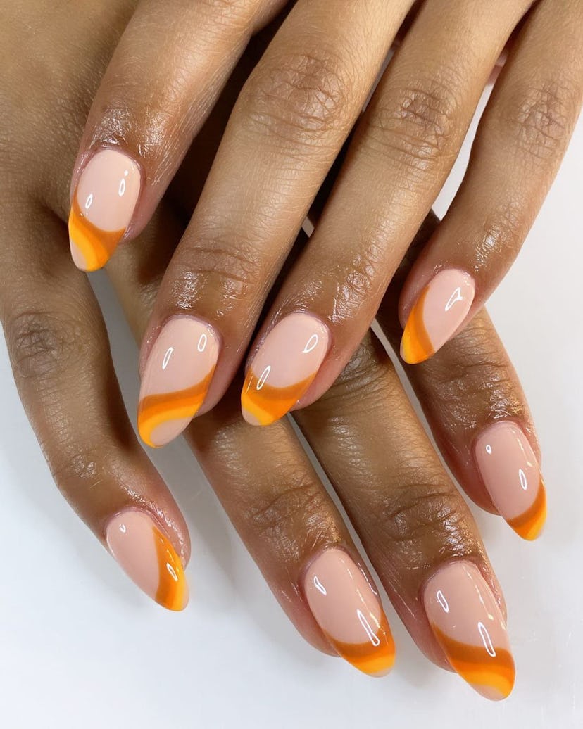 Try peach-colored swirls on your nails for summer 2024.