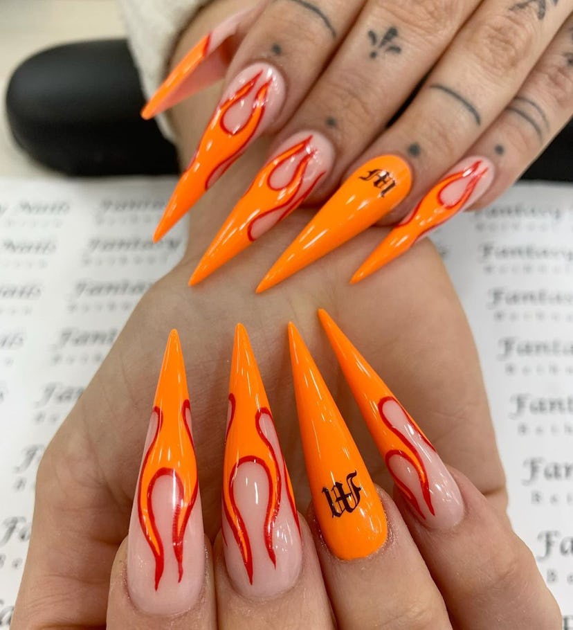 Red and orange flame nail art is perfect for Leo season 2024.