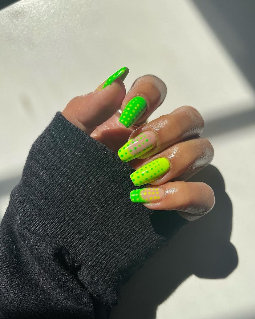 Two-toned green nails with micro dots give 